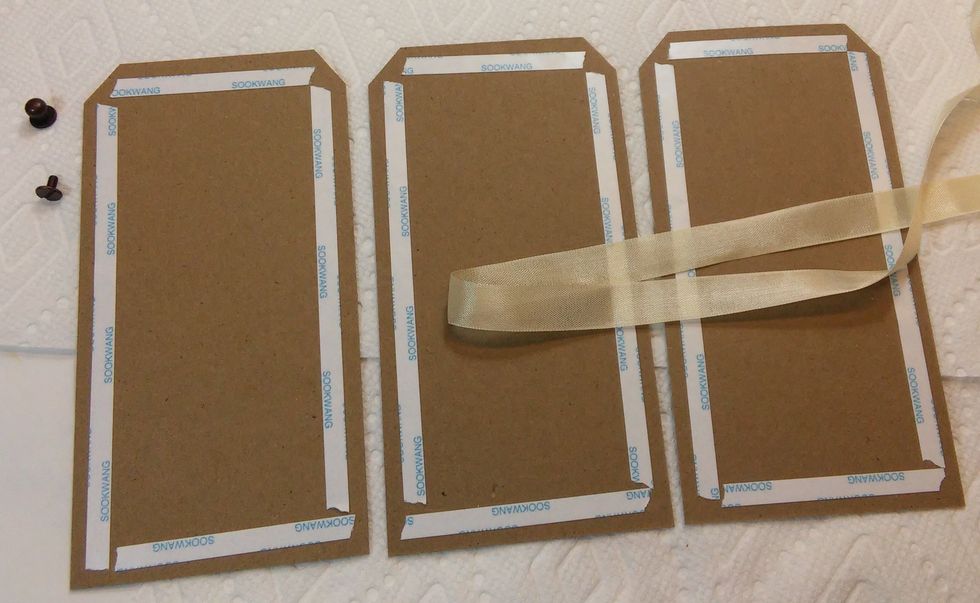 Cardstock tags do not fair the best with all that paint and water, so I like to use A nice sticky double sided tape to stick the outer edges of the tags down. I'll use Fabritac glue for the inside.