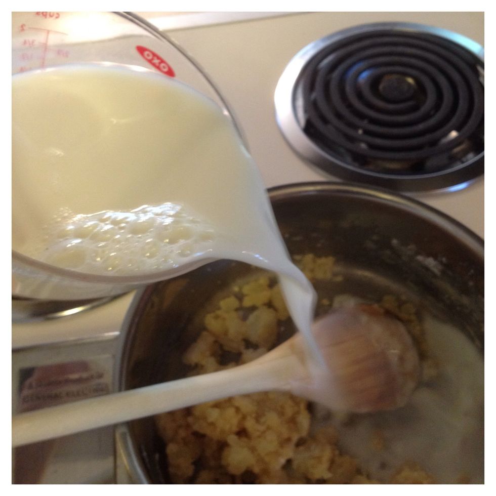 Carefully add milk to onions stirring to combine.