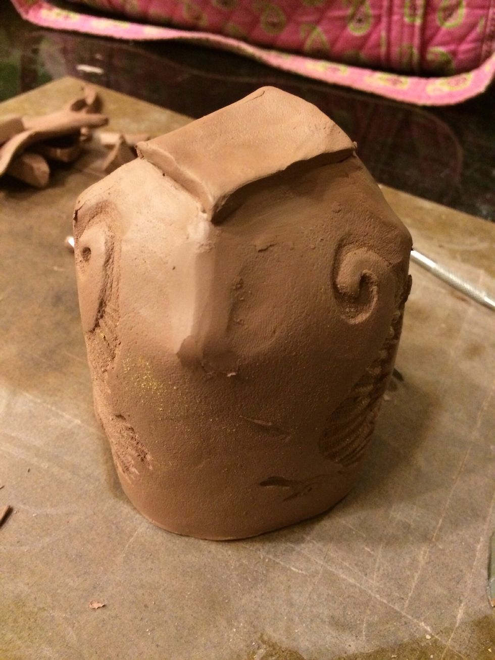 Carefully add the square to the bottom. Flip the cup over in your hand and smooth out all the seams at the bottom of the cup. This is very important or your cup will leak.