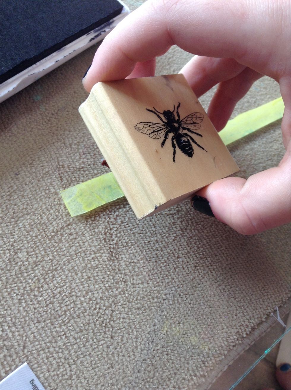 Carefully align where you want your stamp to appear on your tape. Note: the stamp I am using does not entirely fit on the tape, that is ok.