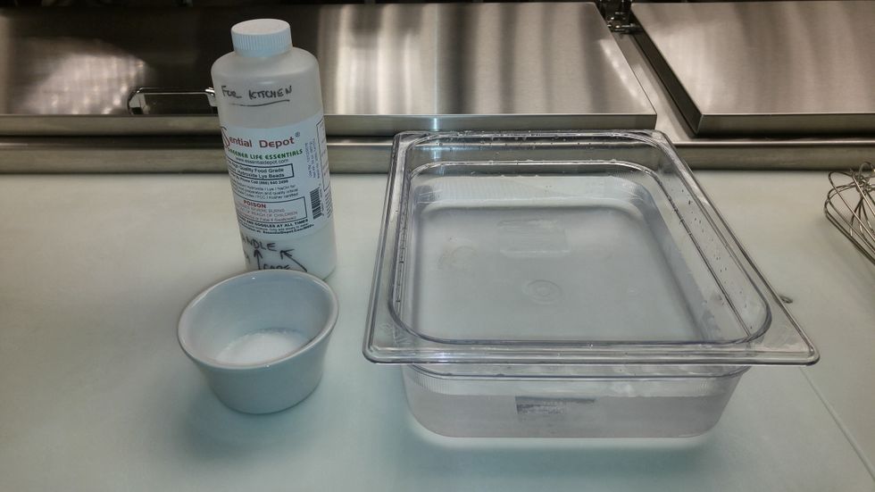 CAREFULLY and SLOWLY add the sodium hydroxide to the water with a whisk, wearing gloves and eye protection. Lye is a highly corrosive chemical and will burn you if it comes in contact with you.