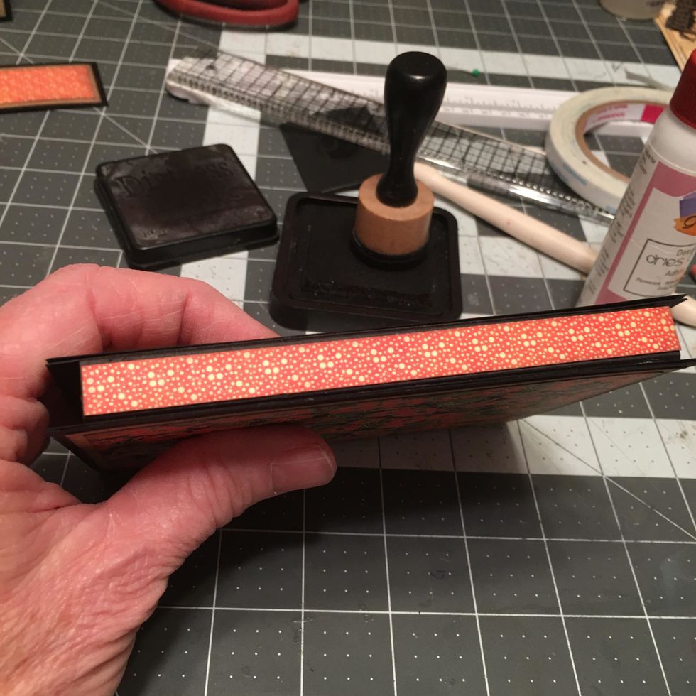 Carefully attach to the outside spine area as shown.