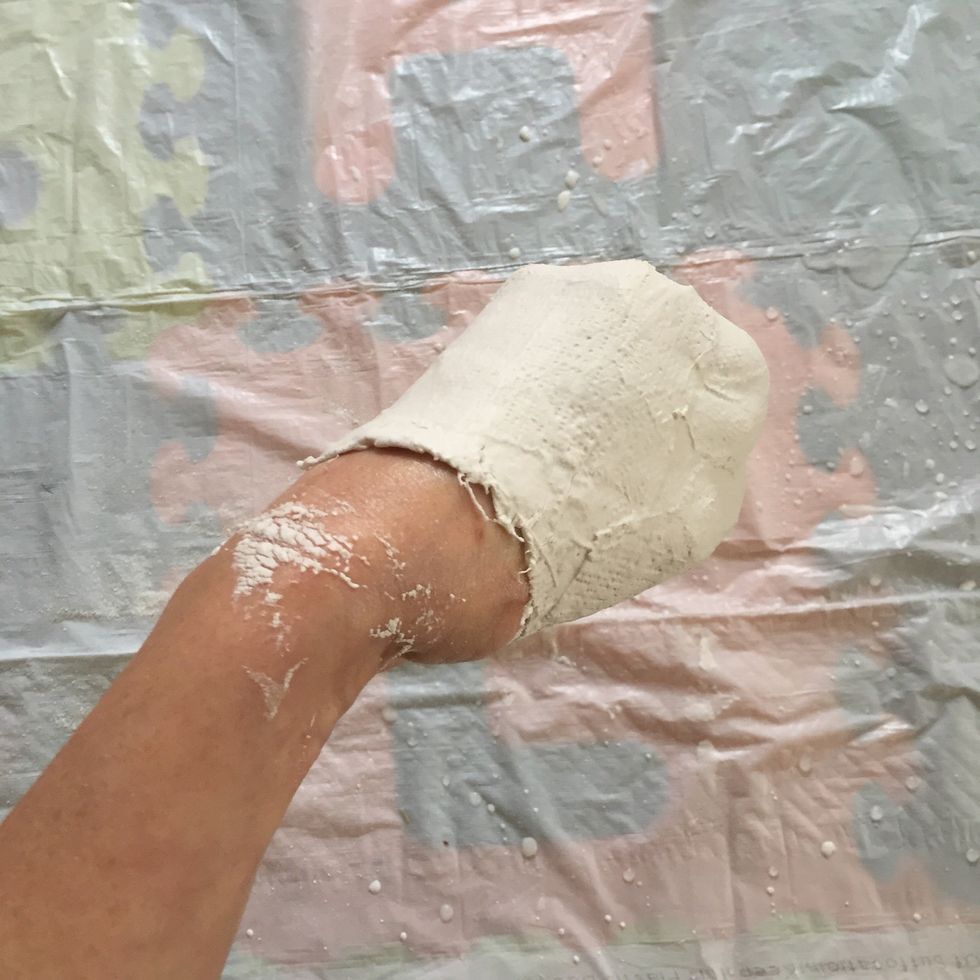 Carefully begin to pull sculpture from your hand