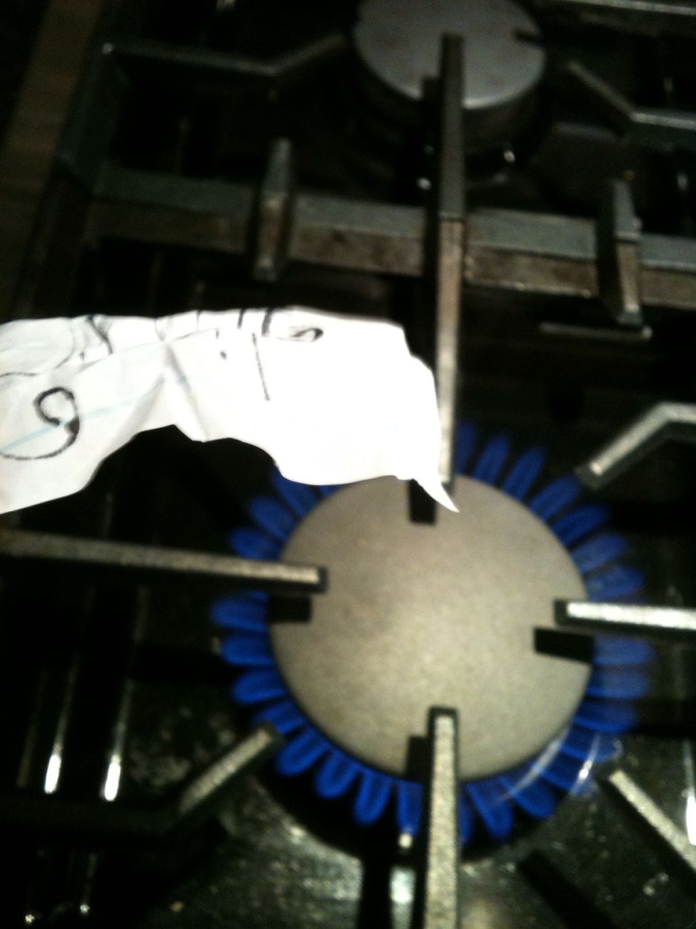 CAREFULLY burn the edges and the middle crimps of your paper.