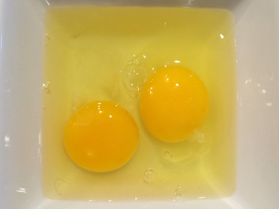 Carefully crack the eggs into a separate bowl and check for egg shells