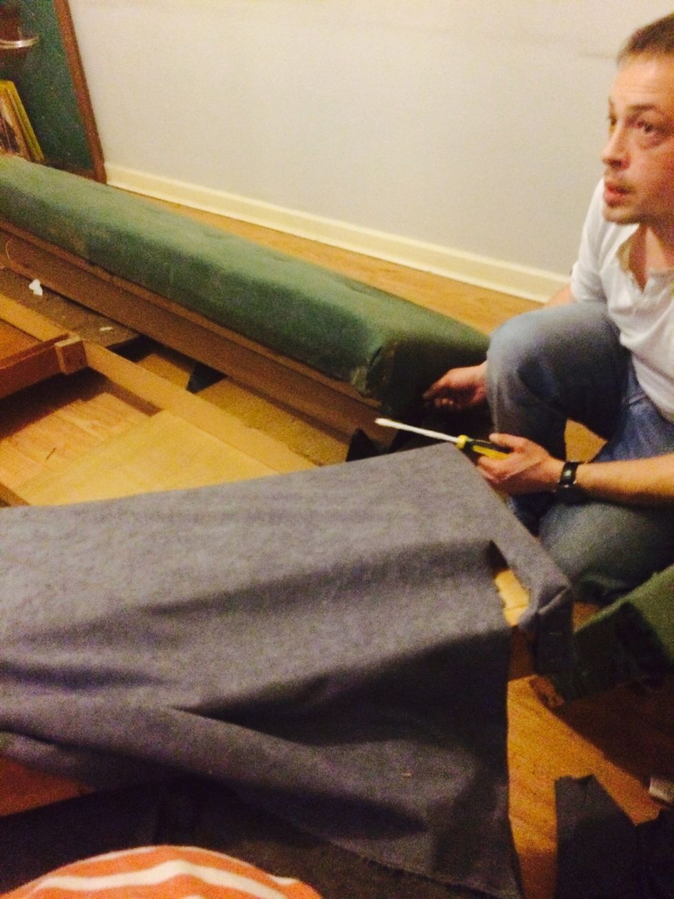 carefully cut & cover the arms of the sofa. Tips are to cut more fabric than you need and cover one side (inside part) only at this stage. Pull as tort as you can to give smooth finish when stapling.