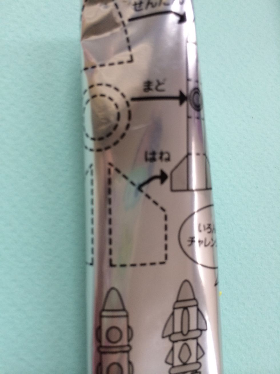 Carefully cut open silver package, be sure not to cut into guides on package