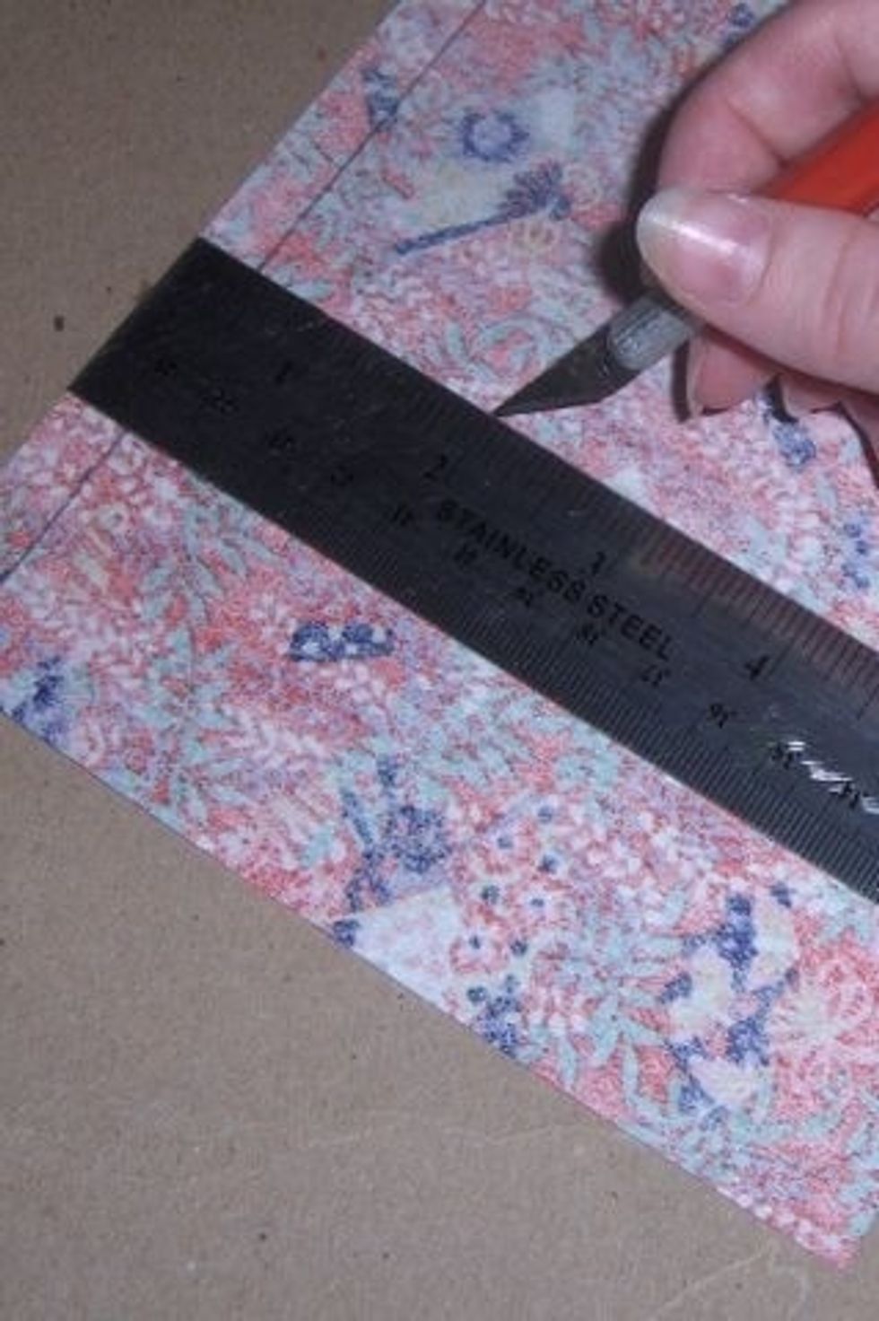 Carefully cut paper using ruler and exacto knife again for a clean, straight line and accuracy.
