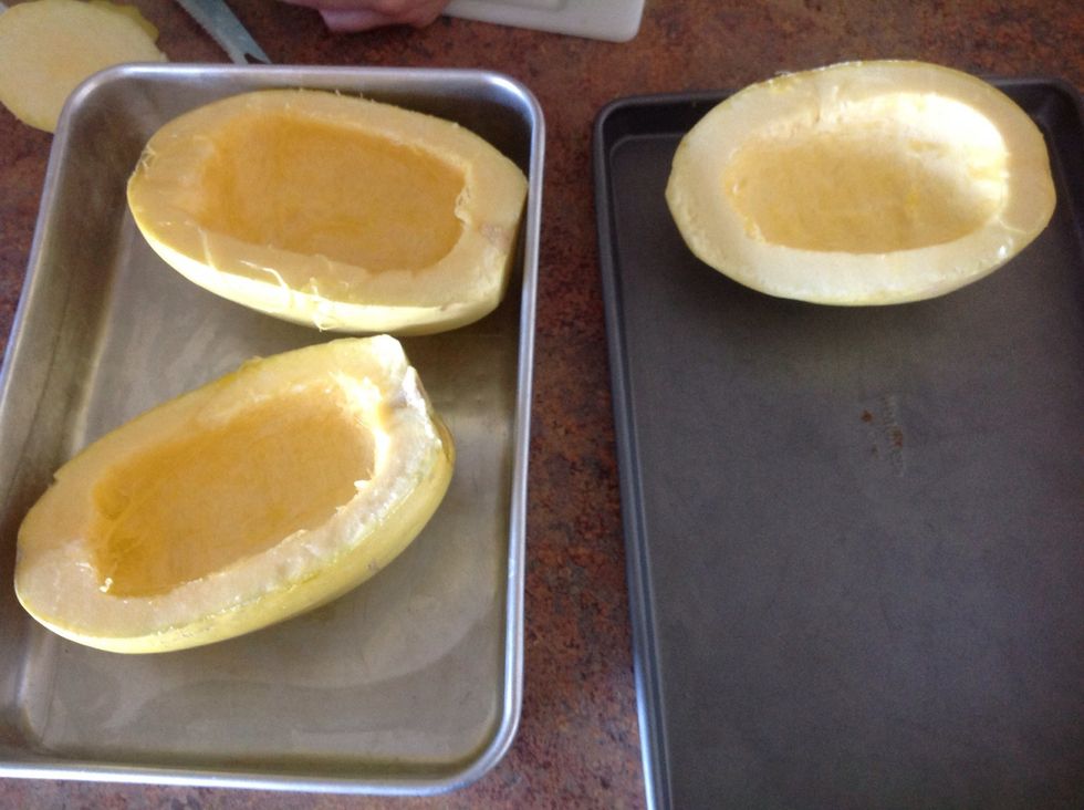 Carefully cut squash down the middle. Scoop out seeds.