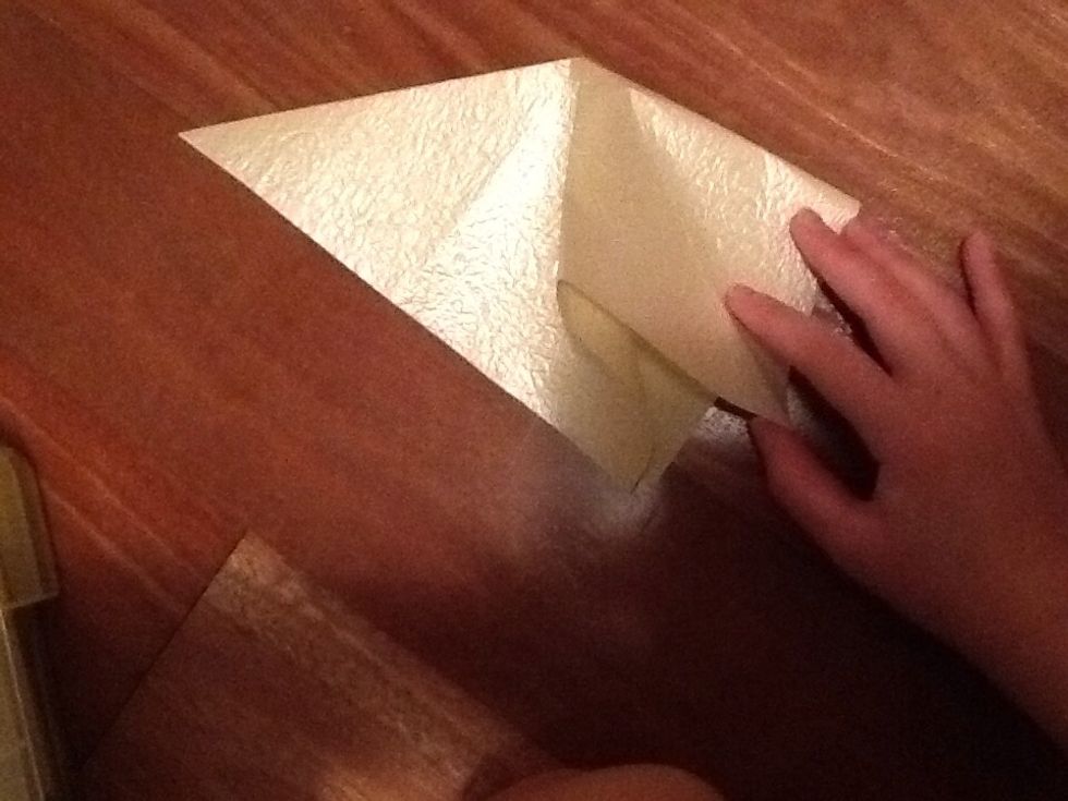 Carefully fold both sides into the middle