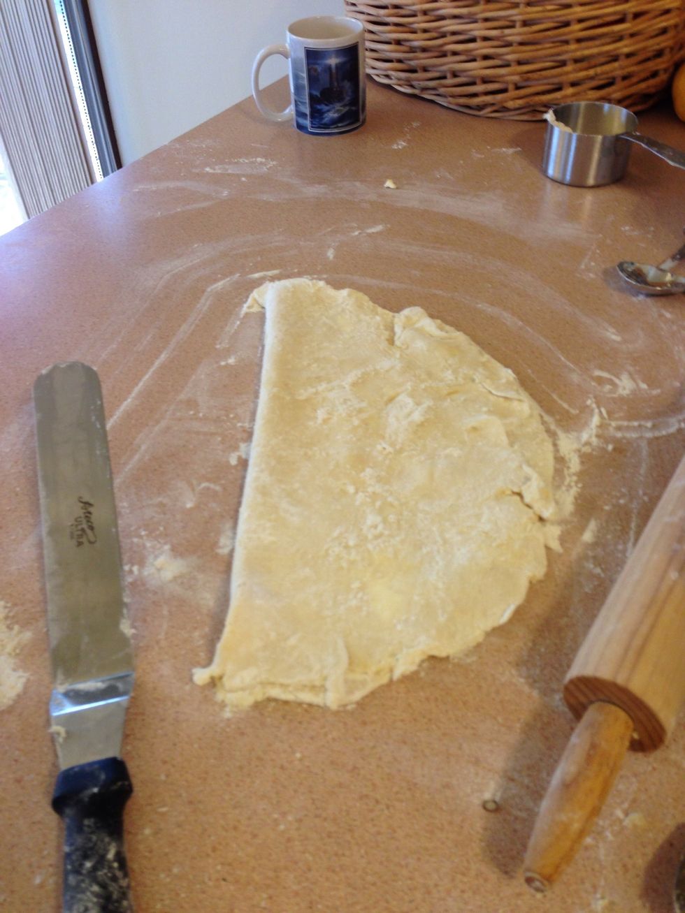 Carefully fold dough in half.