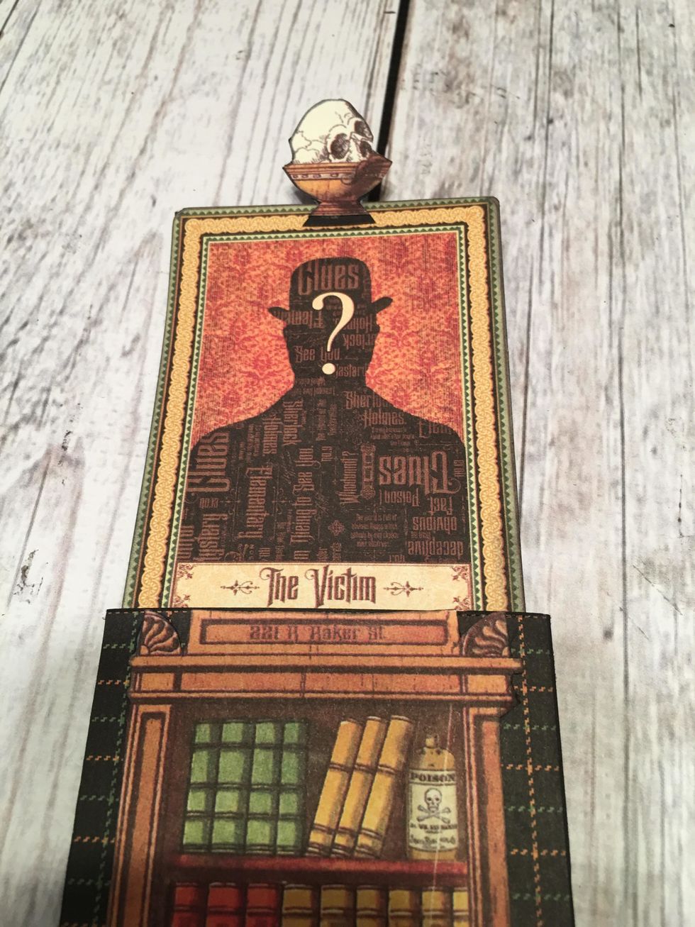 Carefully glue the skull in the bowl to the top of the card image that is in the slider.