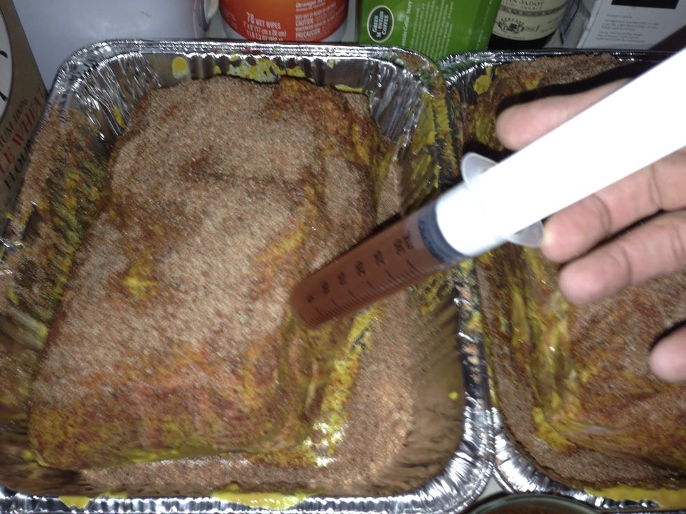 Carefully inject the meat in different areas with the marinade. You want the liquid to mostly be injected into the thick of the meat. Once done, cover with foil and let marinade in fridge overnight.
