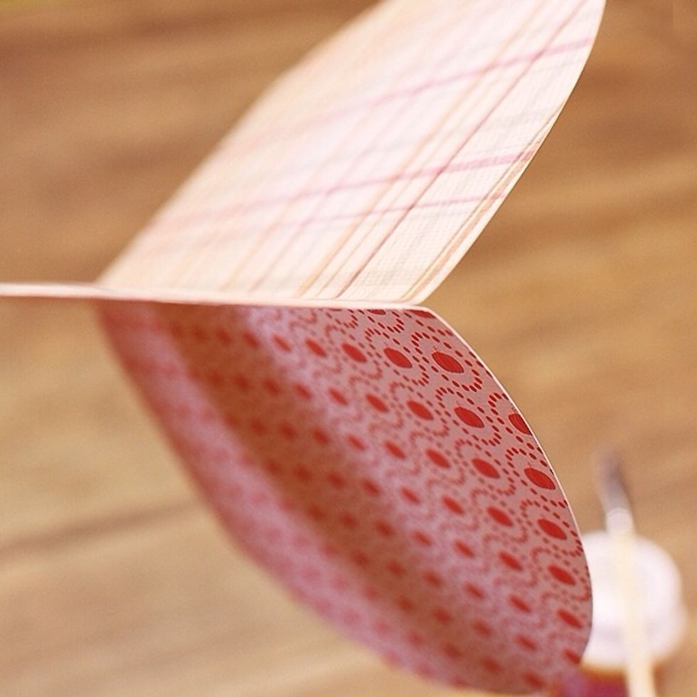 Carefully line up each side to adhere together until all half circles are glued together. If the papers don\u2019t align properly, don\u2019t worry! Scissors can trim them easily.