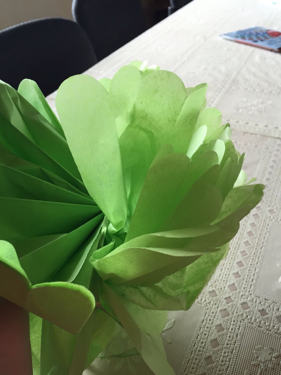 Carefully open up tissue and fluff out each sheet.