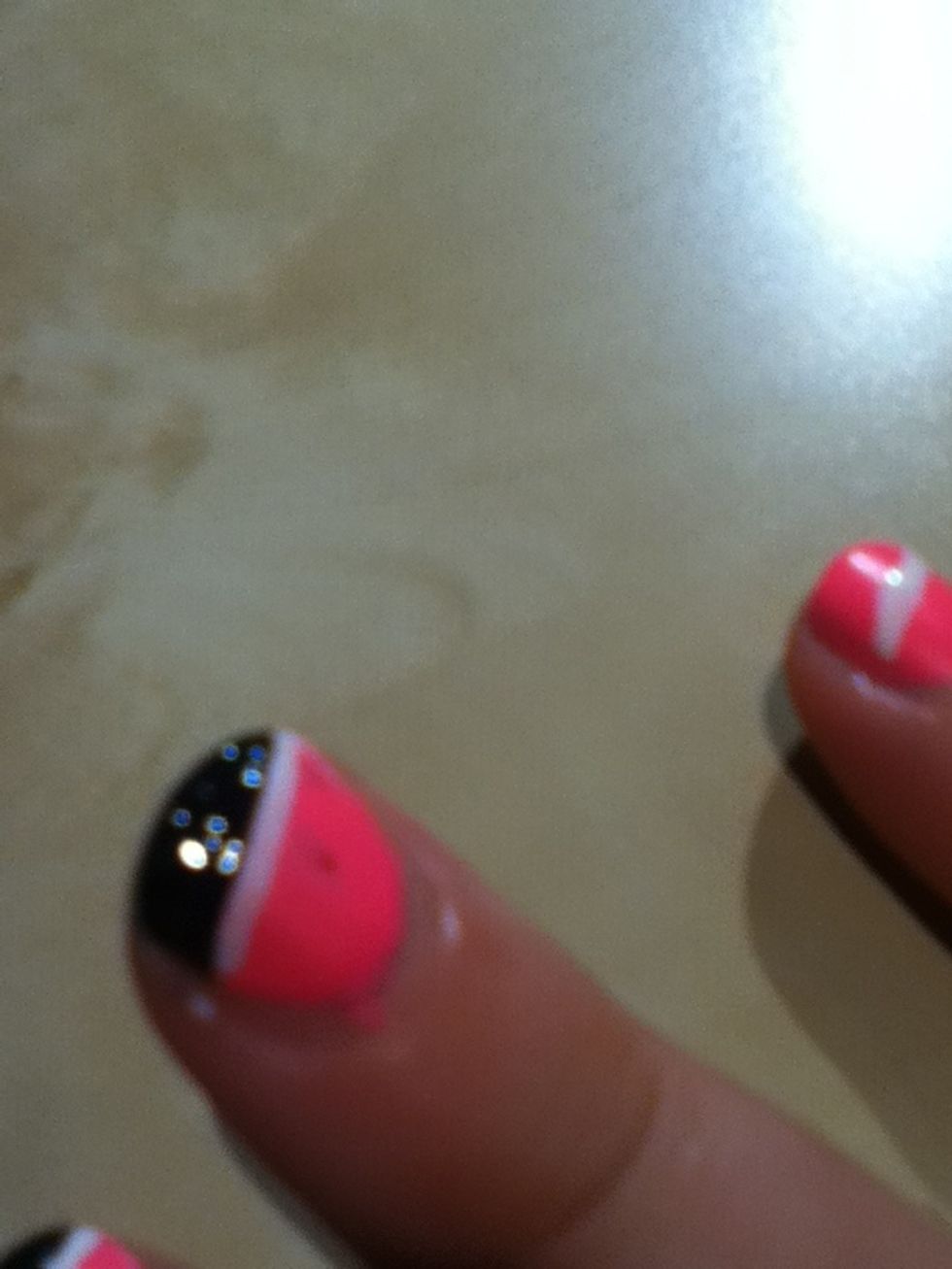 Carefully peel off the tape and voila striped nail. Finish with a top coat to seal the layers and make it last longer