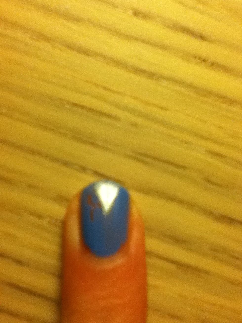 Carefully peel the tape of, you should end up with a triangle at the bottom of your nails.wait for the triangle to dry before you follow the next step .