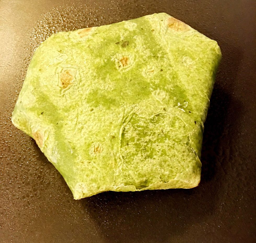 Carefully place it folded side down on a heated griddle or frying pan. Cook til brown and flip if necessary (depending on griddle or pan). 3-4 minutes each side.