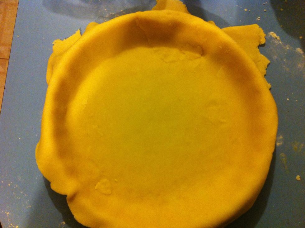 Carefully place the pastry over a greased oven proof pie dish.