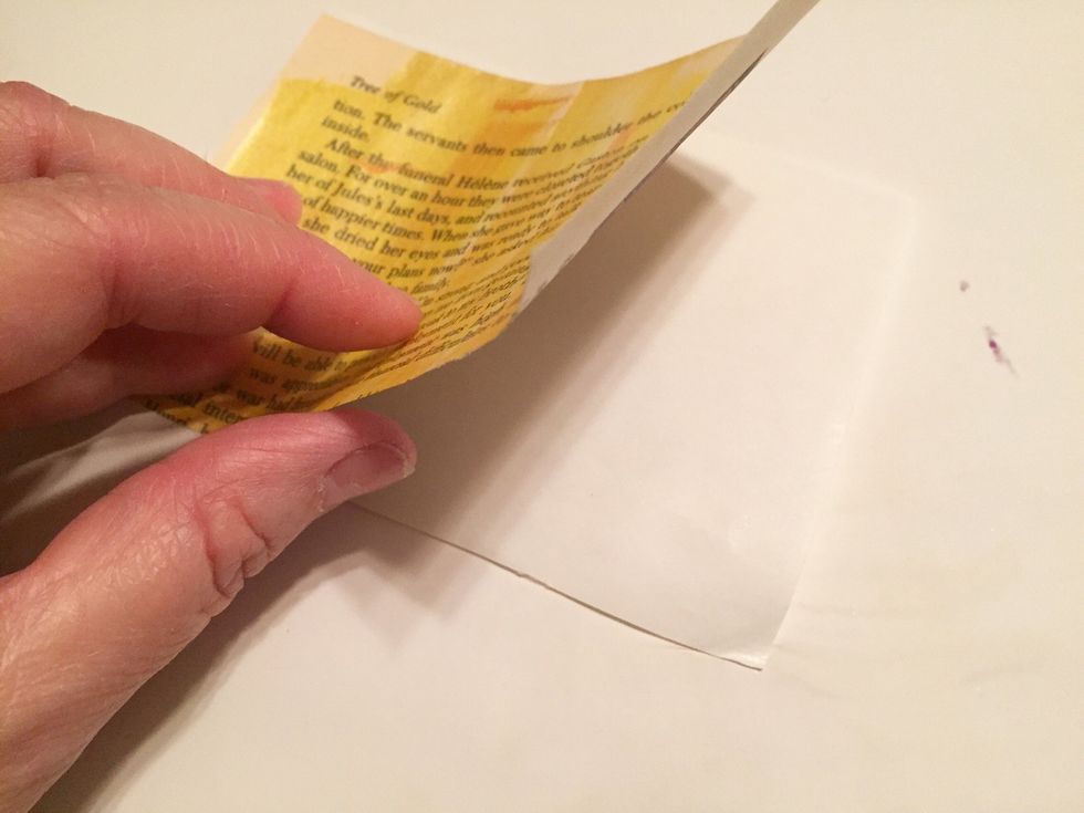 carefully position and place paper over adhesive. work CAREFULLY - once paper touches adhesive it's STUCK!