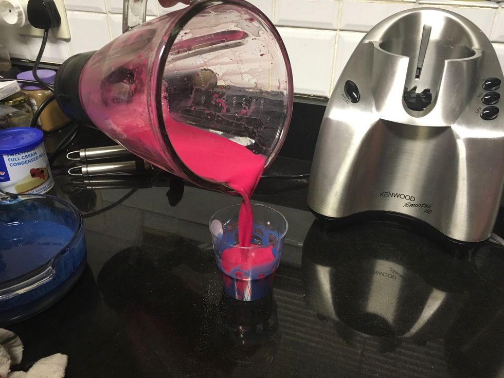 Carefully pour the pink mixture into the cup