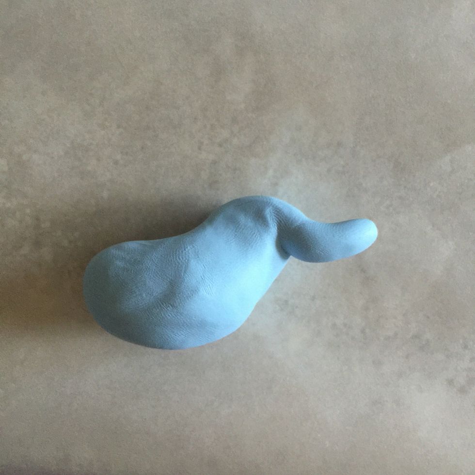 Carefully pull part of its head and form to start his trunk.