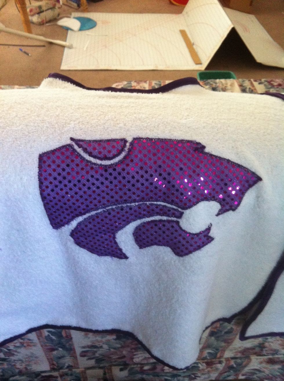 Carefully pulled of paper on top and at the edges. Carefully cut away fabric do white towel showed through. I'm very happy with finished product.