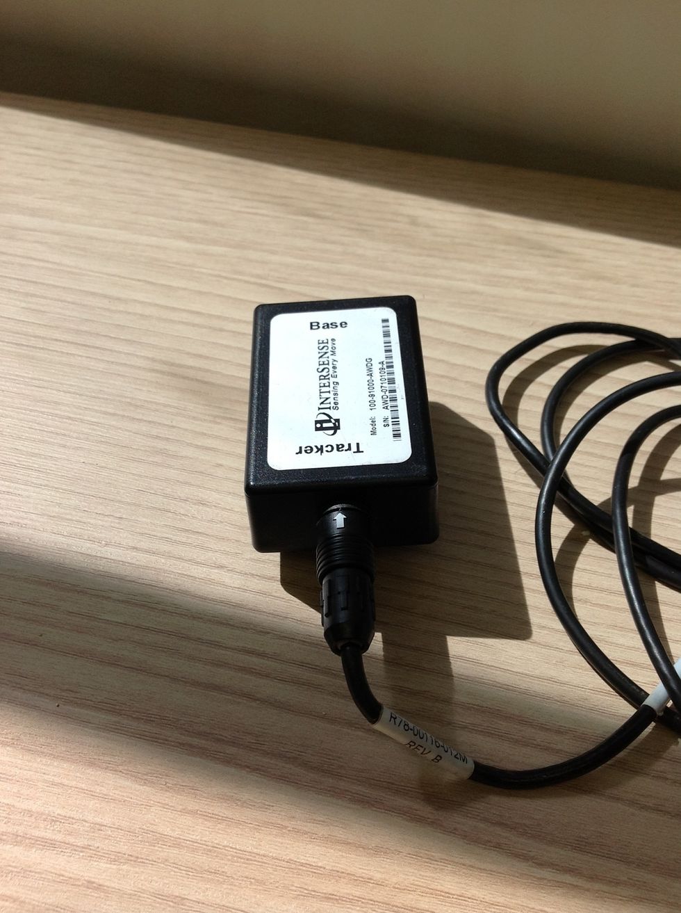Carefully push the barrel connector into the belt pack, matching up the white arrows as shown
