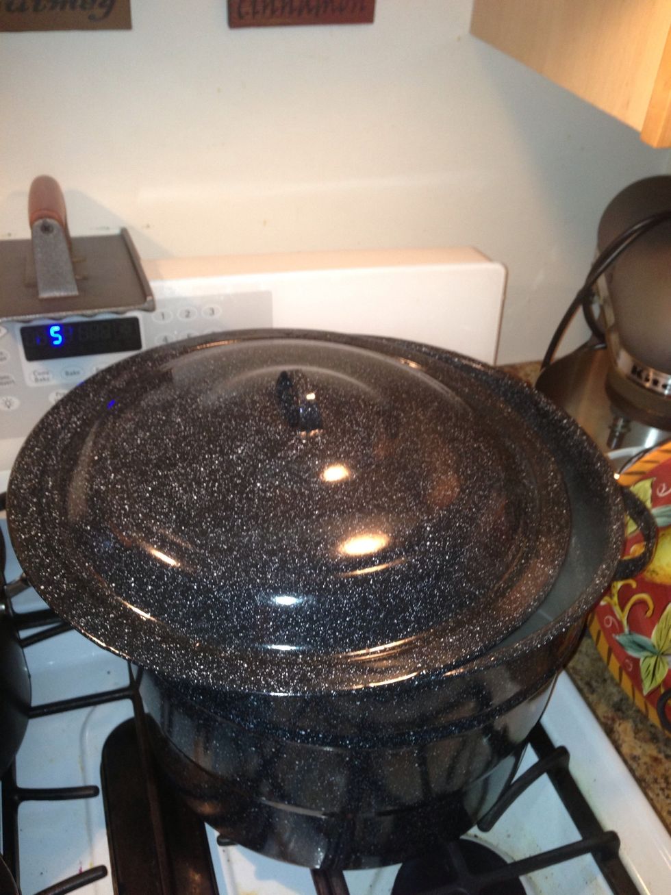 Carefully push the hot water away from the edge if the stove. Leave the lid cracked and let it humidify your air while its cooling off.