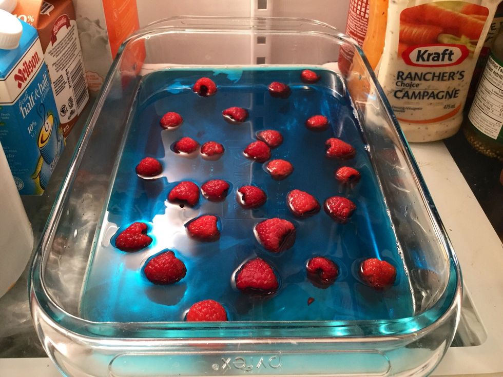 Carefully put it in your fridge and let it sit for a few hours or until it is no longer "liquidy"