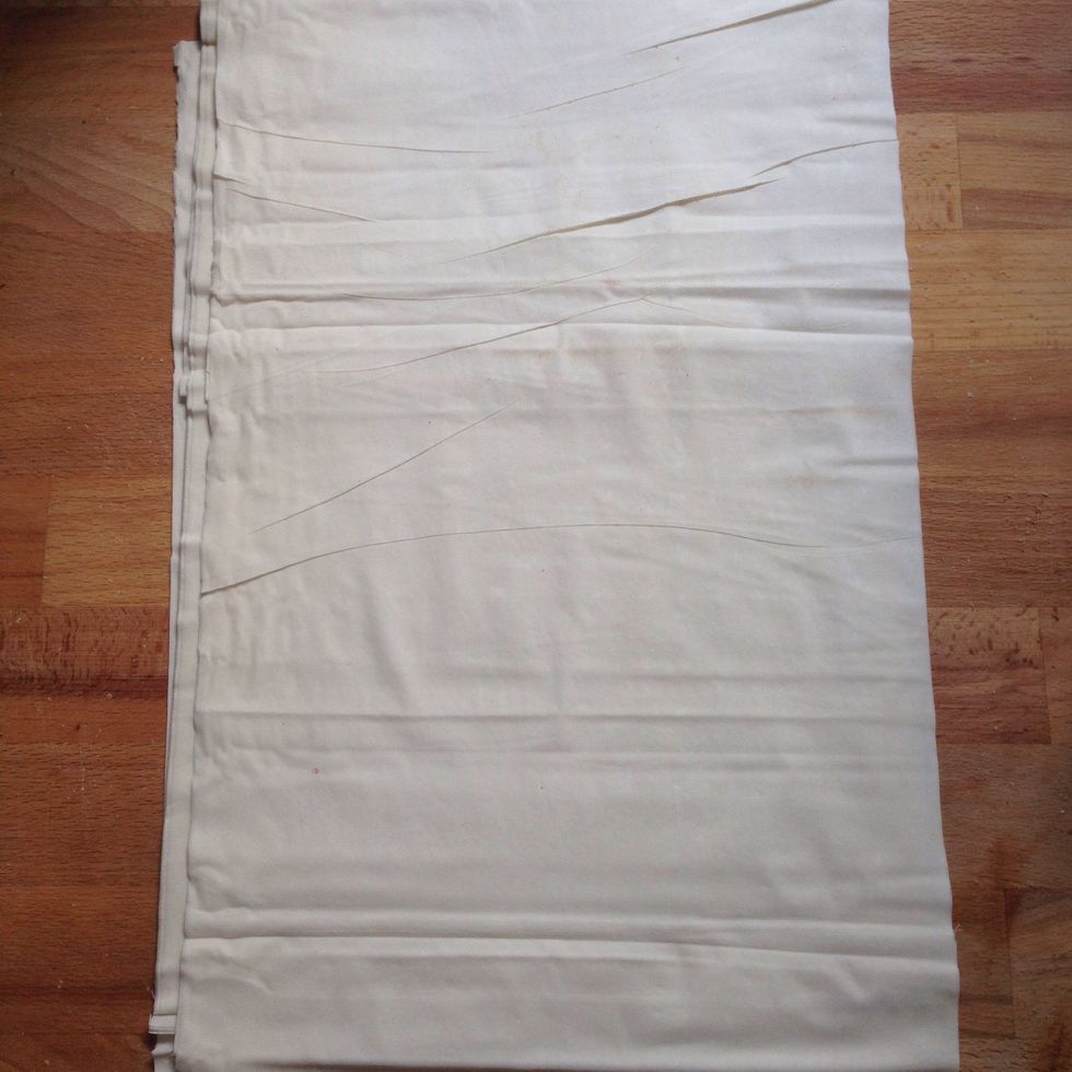 Carefully remove FILO dough from the box and place on a dry clean surface. You will notice it is very fragile so take care not to tear it.