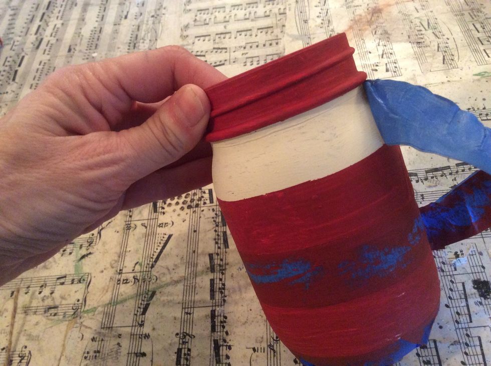 Carefully remove the painter's tape from the striped jars.