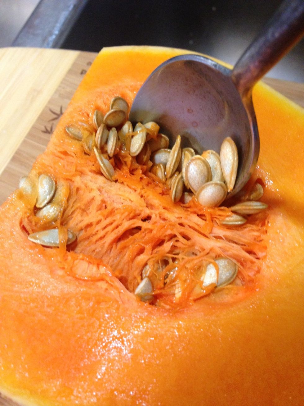 Carefully scoop it's seeds out with a spoon...