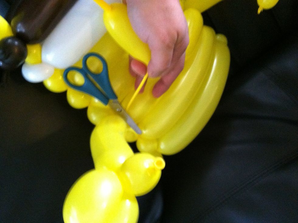 Carefully secure and cut off extra pieces. Save the largest piece to reinflate for the nose