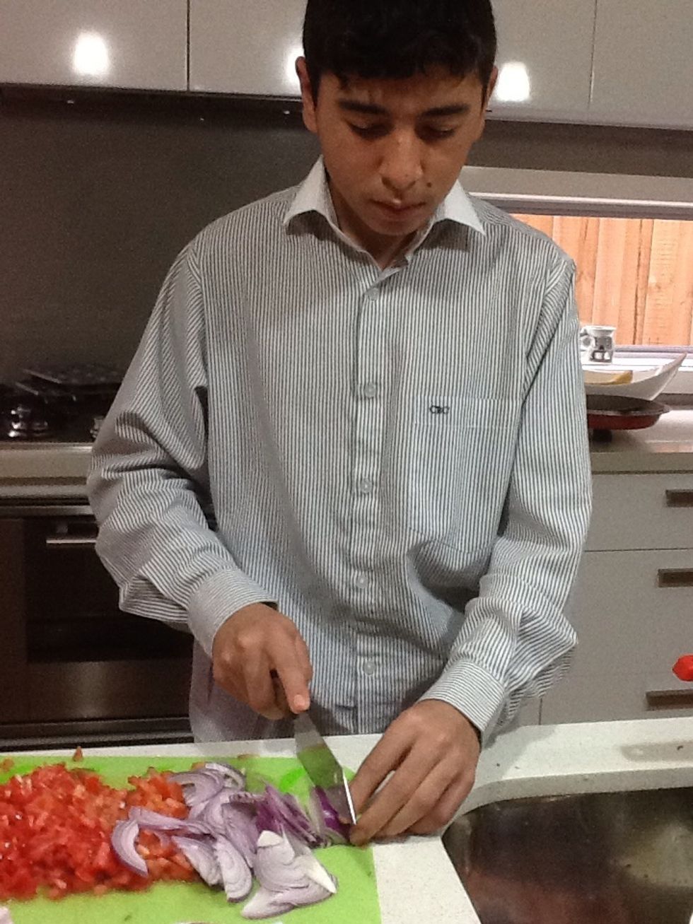 Carefully slice the red onion into fine slices. You do not need a sharp knife like I used.