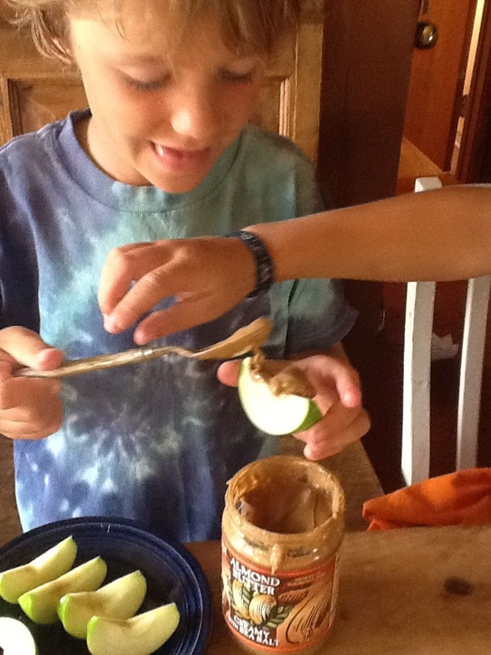 Carefully smear it on the apple slice. And be ready for your brother to want some too, because it is so yummy.
