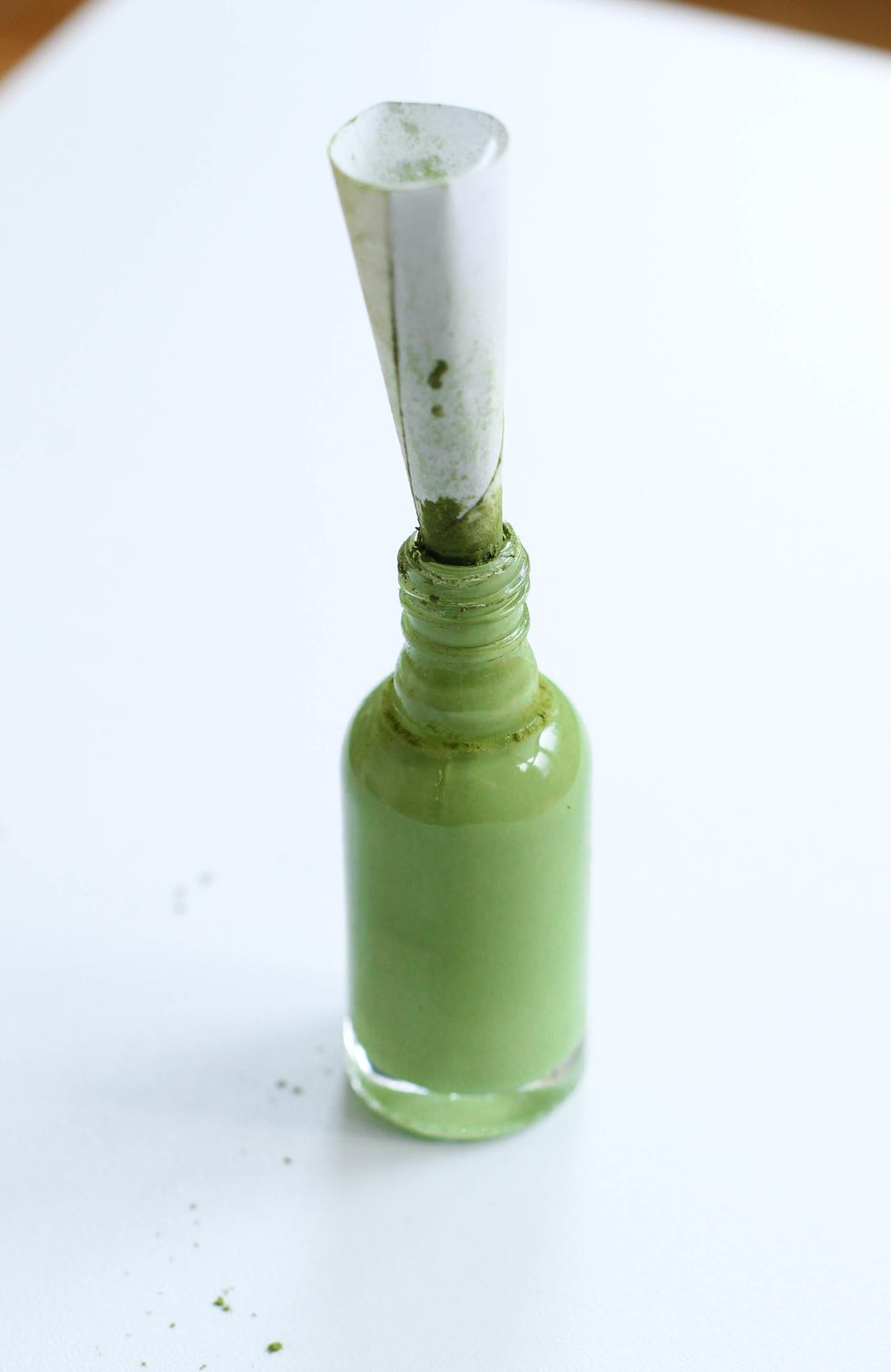 Carefully spoon the matcha powder into your bottle of white nail polish. Shake well. Add a few drops of nail polish remover. Shake some more. ... Keep shaking. The shade is up to you!