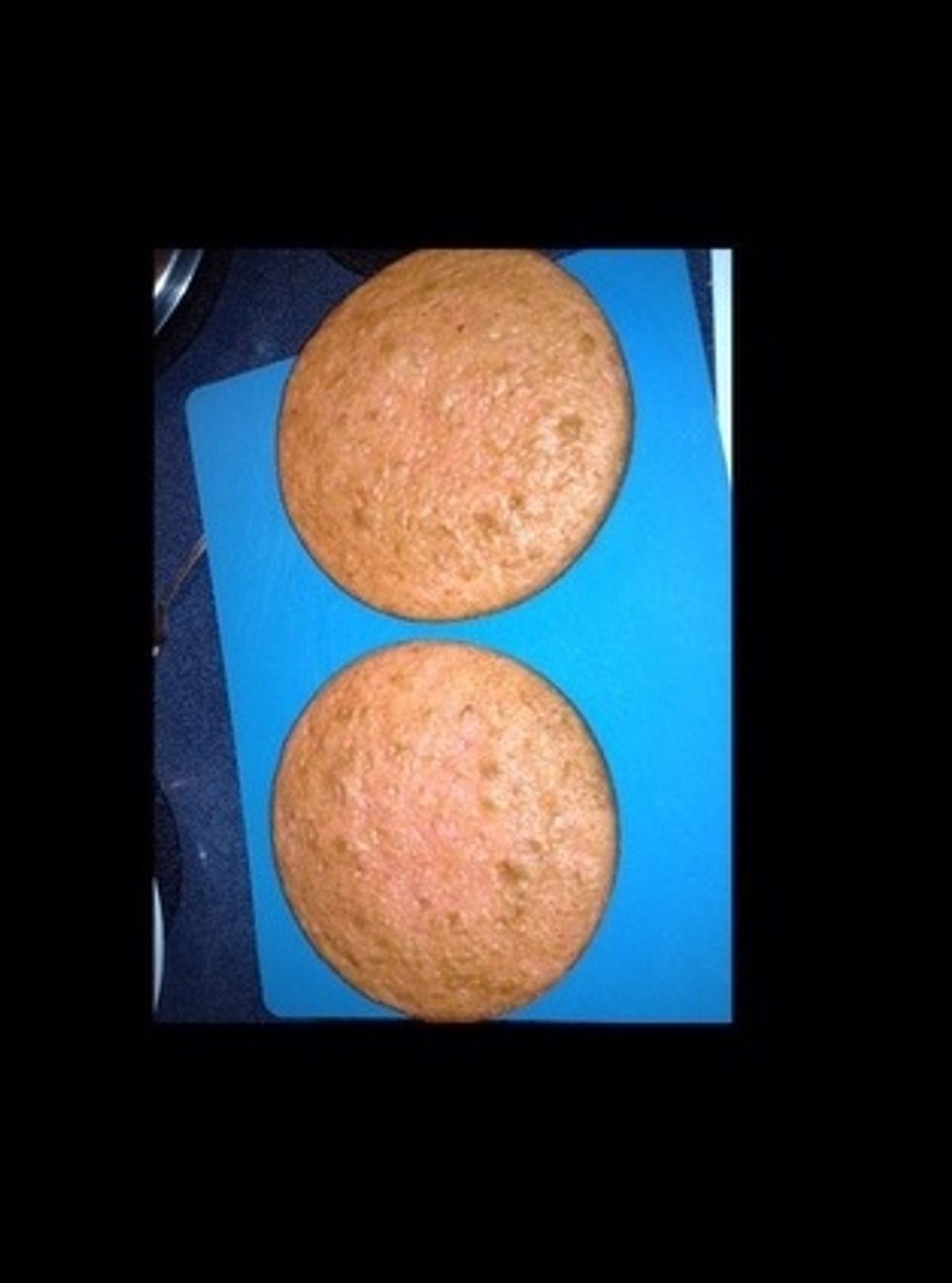 Carefully take cake out of the pans.