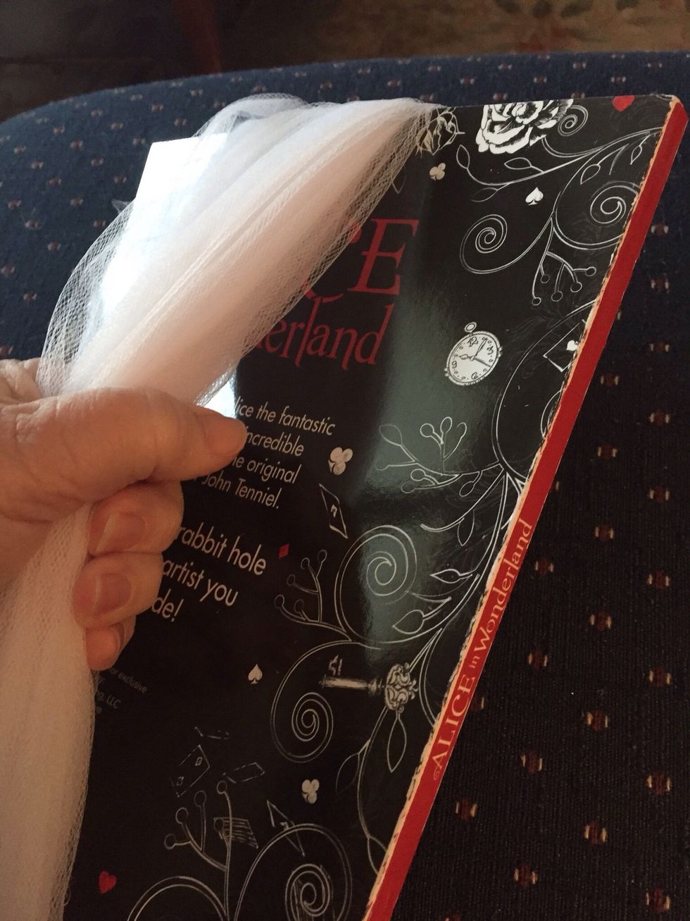 Carefully take tulle off magazine...