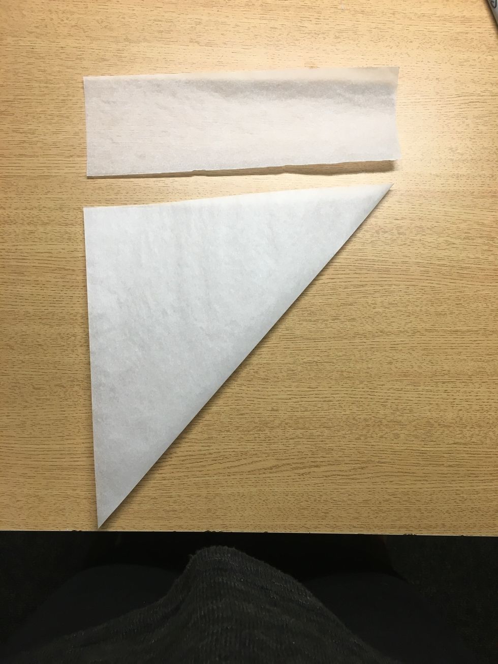 Carefully tear off excess paper and set it aside. This can be used for smaller snowflakes.