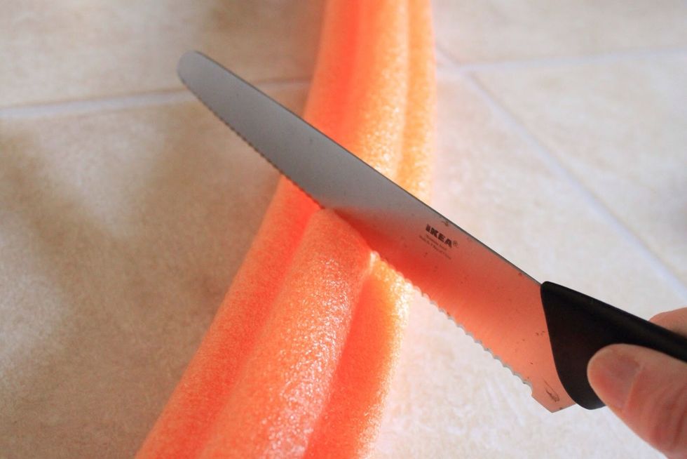 Carefully use a knife to cut a 1ft long piece of pool noodle.