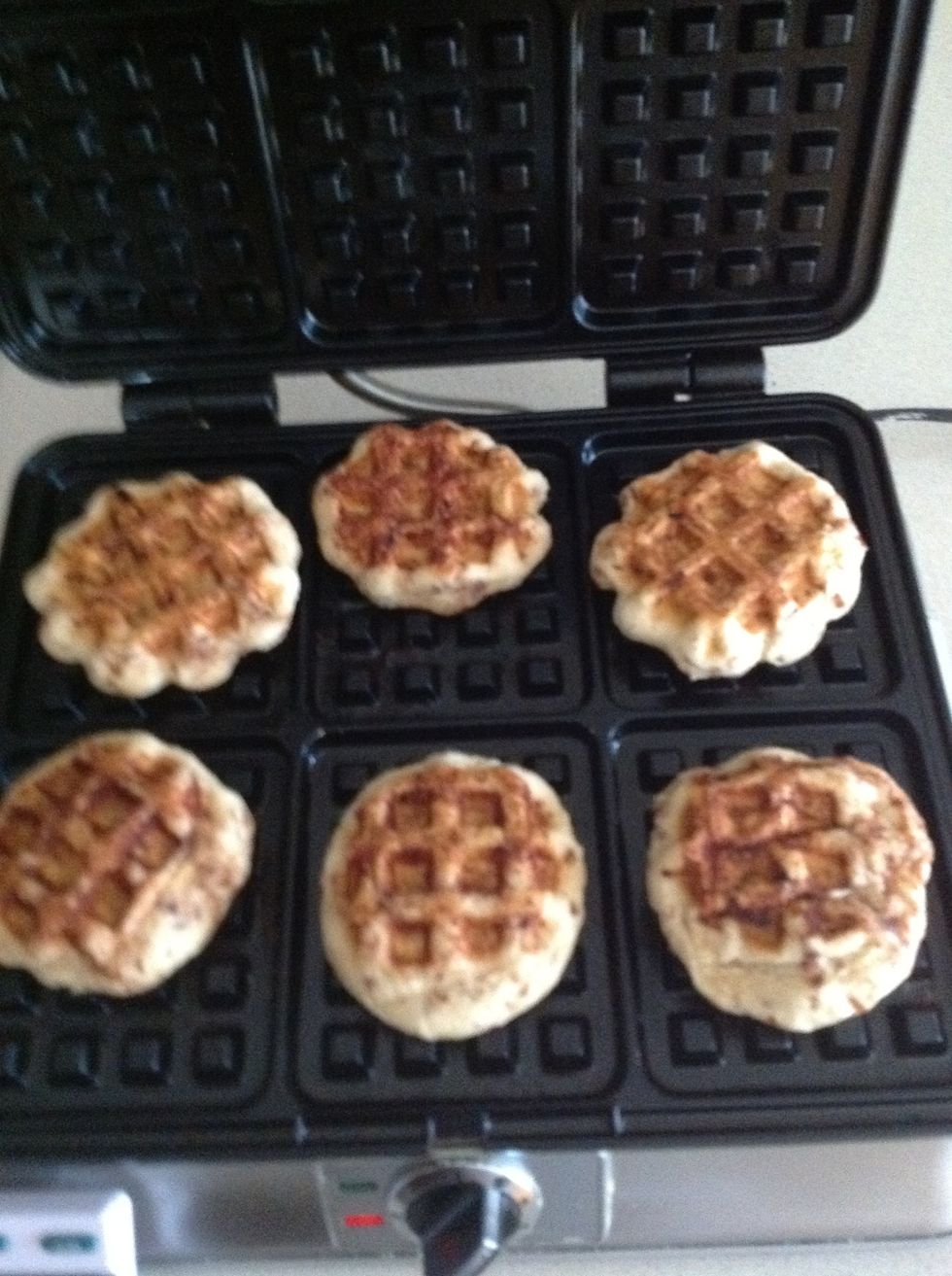 Carefully use spatula to remove the cinnamon rolls and place them on a plate.