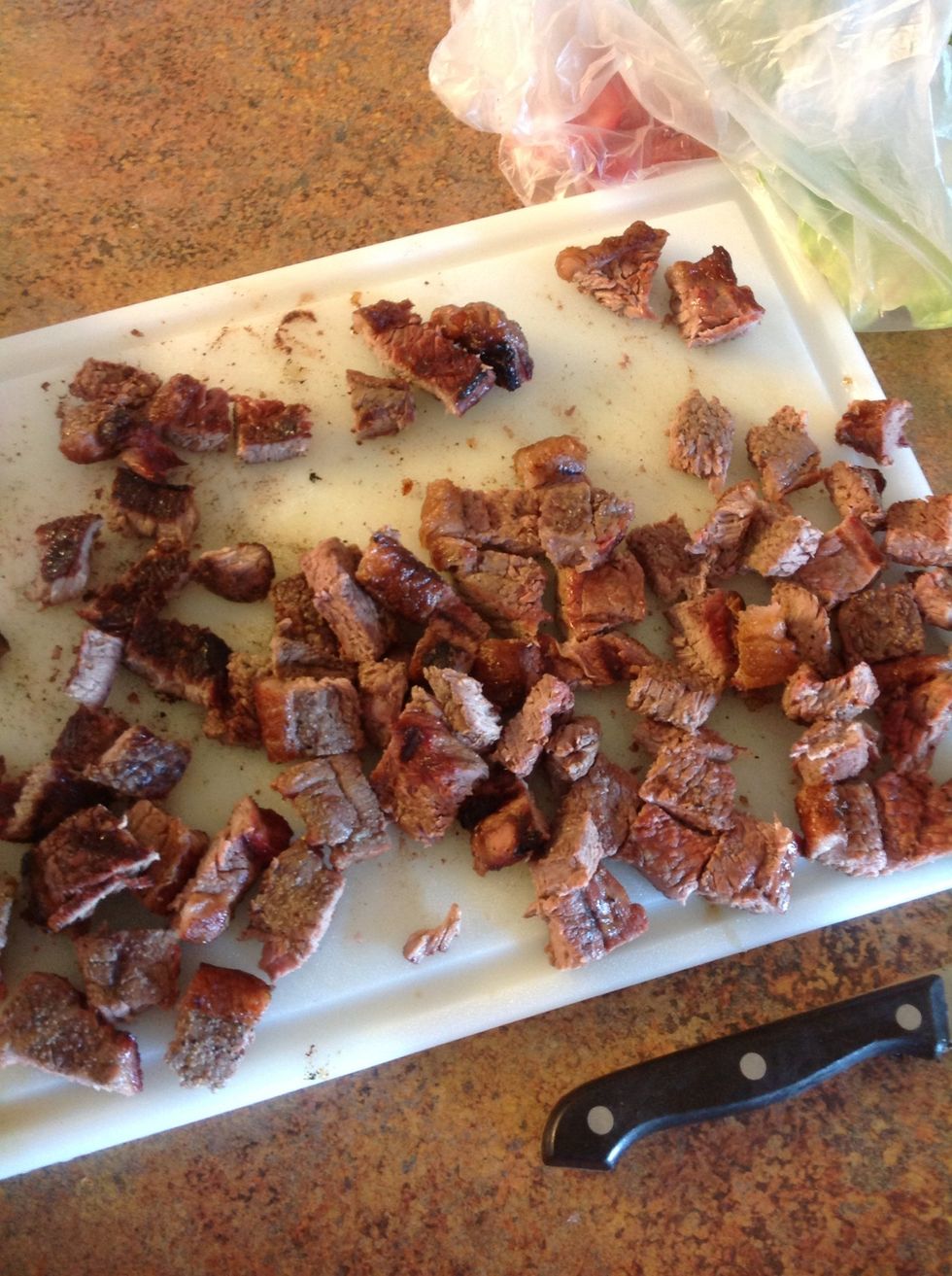 Carefully using knife and cutting board cut the lettuce into small pieces add to salad.