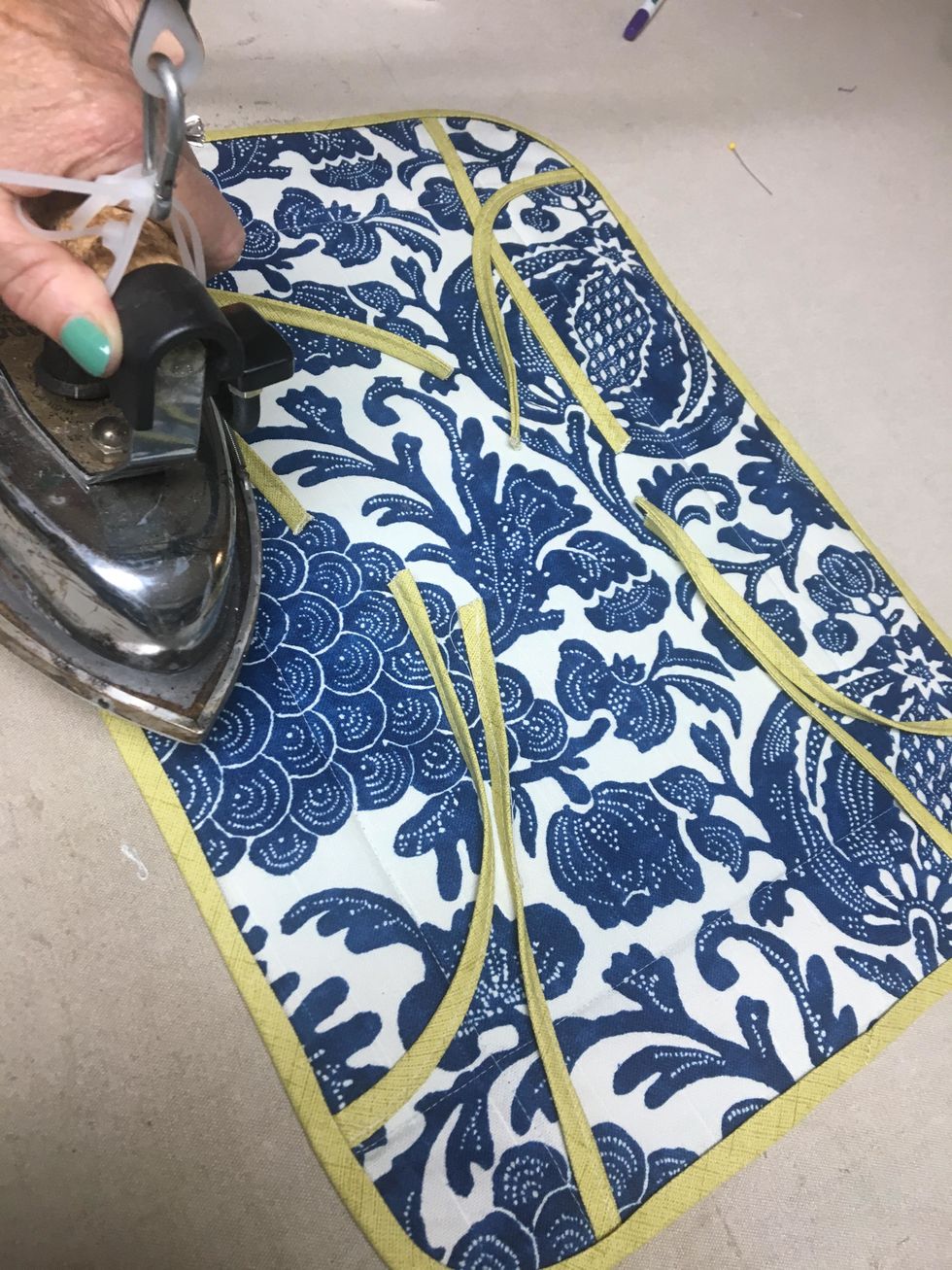 Carefully wrap the bias banding around the edge and press in place making sure it wraps around evenly.