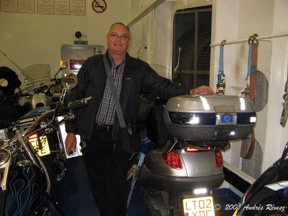 Carry a big box on the scooter to use for your helmet and daily living needs...maps, day pack, medicines, extra layers... And carry straps or tie downs to use in the ferry