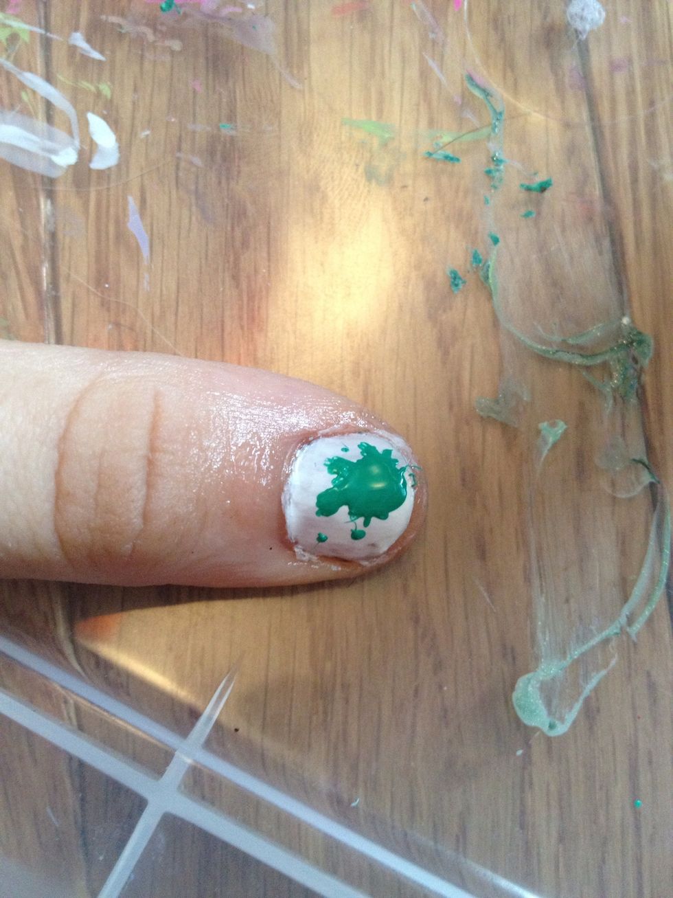 Carry out the polish and put dots on your nails with a toothpick.