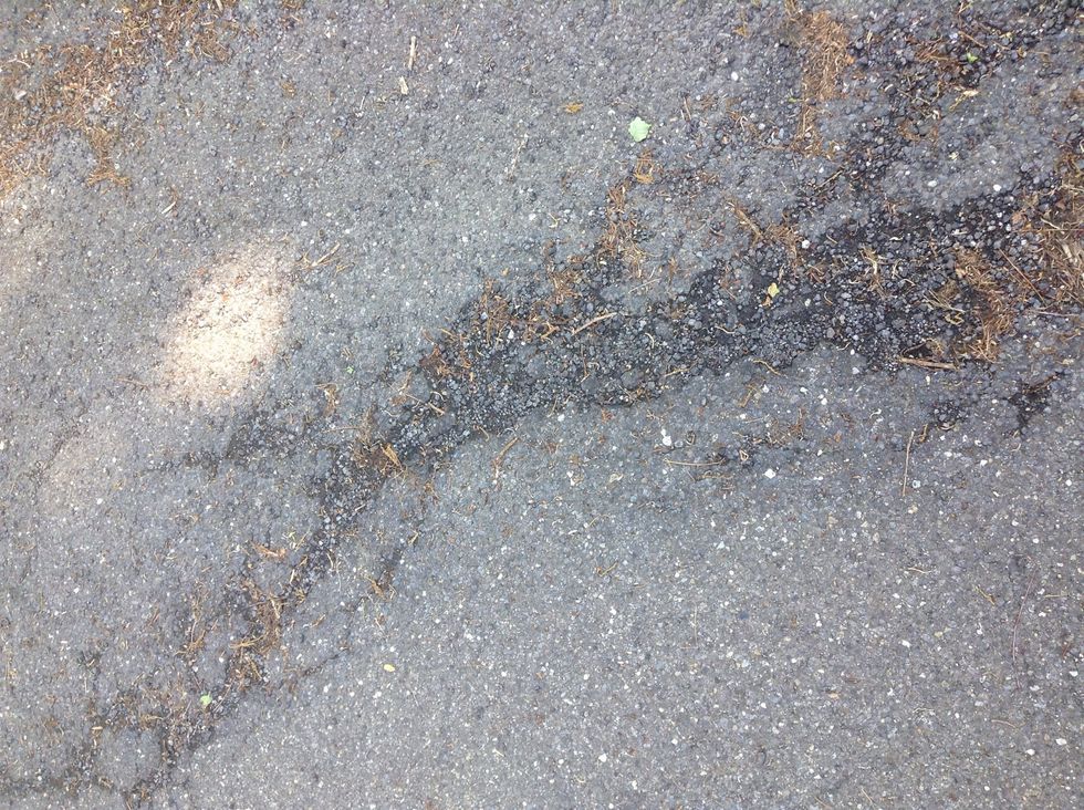 Cars and other causes weathered down this concrete so it will crack and make other smaller rocks. (Weathering)