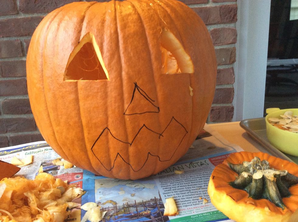 Carve the second eye out with the smaller knife.