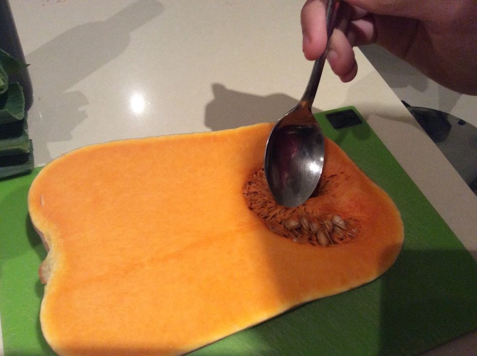 Carve the seeds out of the pumpkin