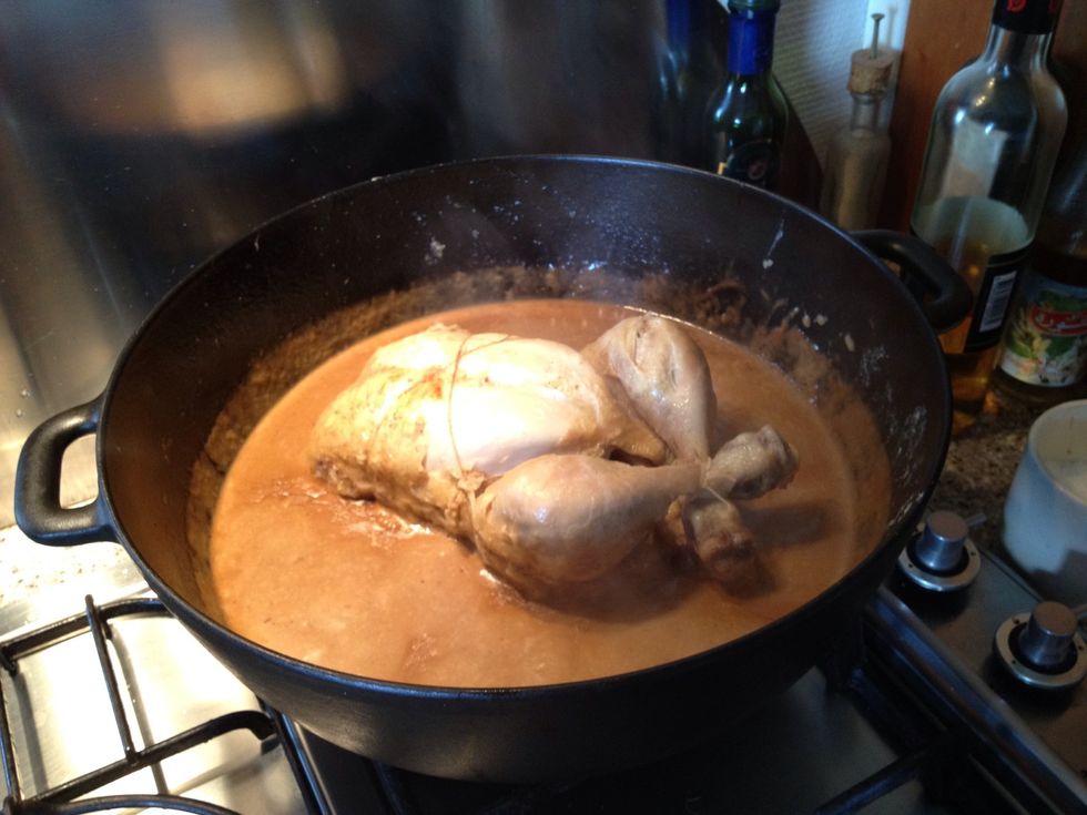 Cast iron will keep warm for long. So back with chicken, lid on, heat off and it will keep warm for at least 1/2 an hour. Serve with salad ,potatoes,your favoured veggie and instant pickled cucumber.